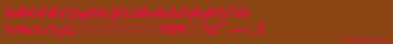 Macadamia Font – Red Fonts on Brown Background