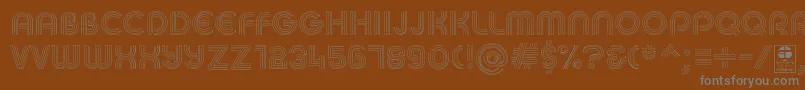 MACCOS LIGHT Demo-fontti – harmaat kirjasimet ruskealla taustalla