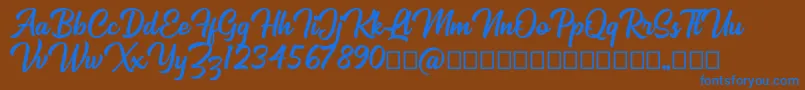 Mackless Script Font – Blue Fonts on Brown Background