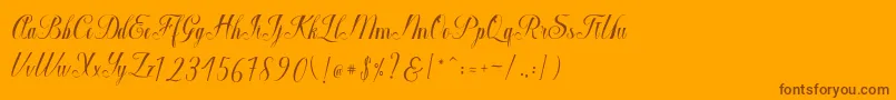 Macrofhyllya Script-fontti – ruskeat fontit oranssilla taustalla