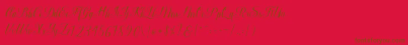 Macrofhyllya Script-Schriftart – Braune Schriften auf rotem Hintergrund