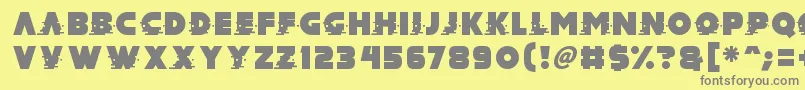 フォントMad Hacker – 黄色の背景に灰色の文字