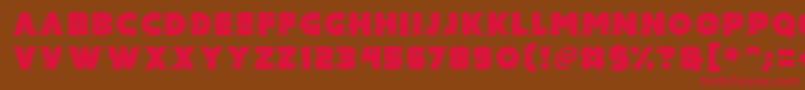 フォントMad Hacker – 赤い文字が茶色の背景にあります。