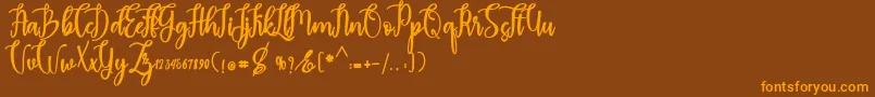 madam Font – Orange Fonts on Brown Background