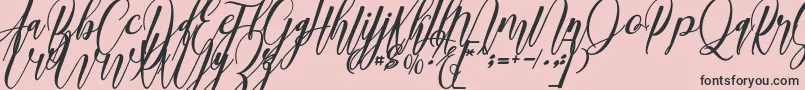 madani Font – Black Fonts on Pink Background