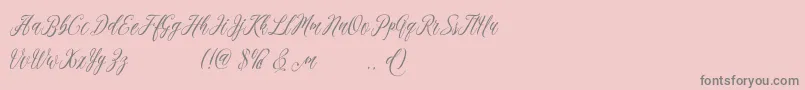 madania free-Schriftart – Graue Schriften auf rosa Hintergrund