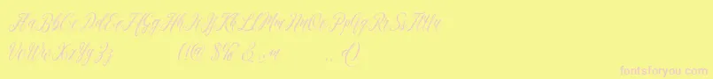 madania free-Schriftart – Rosa Schriften auf gelbem Hintergrund