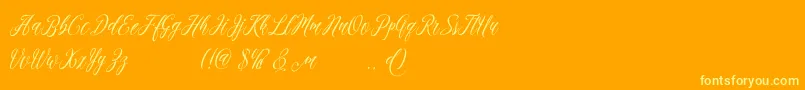 madania free-Schriftart – Gelbe Schriften auf orangefarbenem Hintergrund