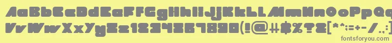 MADE IN EARTH-fontti – harmaat kirjasimet keltaisella taustalla