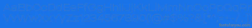 MADE Outer Sans Outline Thin PERSONAL USE-fontti – harmaat kirjasimet sinisellä taustalla