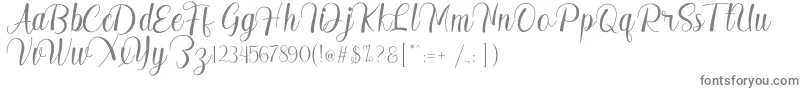 フォントMadelyn – 白い背景に灰色の文字