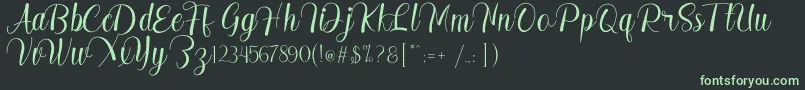 フォントMadelyn – 黒い背景に緑の文字