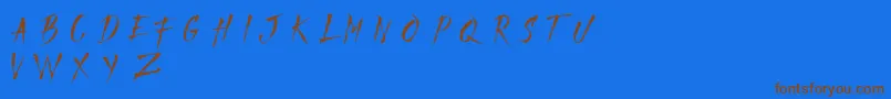 Czcionka MADFAITH   DEMO – brązowe czcionki na niebieskim tle