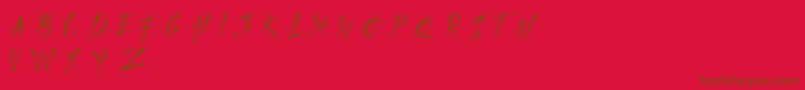 Czcionka MADFAITH   DEMO – brązowe czcionki na czerwonym tle