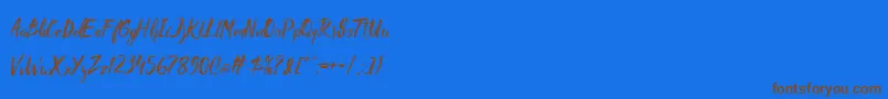 Czcionka Madhouz – brązowe czcionki na niebieskim tle