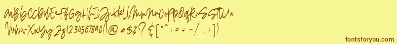フォントmadigel free – 茶色の文字が黄色の背景にあります。