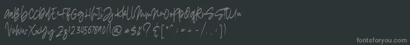 フォントmadigel free – 黒い背景に灰色の文字