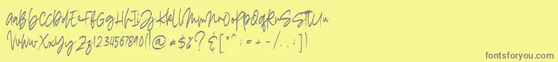 madigel free-Schriftart – Graue Schriften auf gelbem Hintergrund