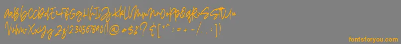 フォントmadigel free – オレンジの文字は灰色の背景にあります。
