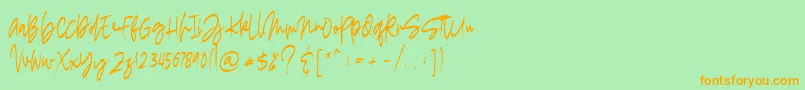 madigel free-Schriftart – Orangefarbene Schriften auf grünem Hintergrund