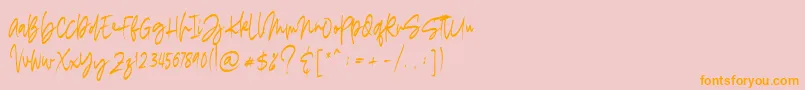 フォントmadigel free – オレンジの文字がピンクの背景にあります。
