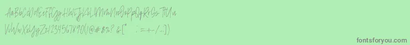 madison avenue SAMPLE-Schriftart – Graue Schriften auf grünem Hintergrund