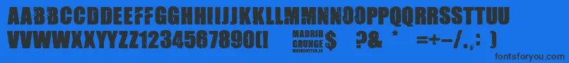 Madrid Grunge-Schriftart – Schwarze Schriften auf blauem Hintergrund