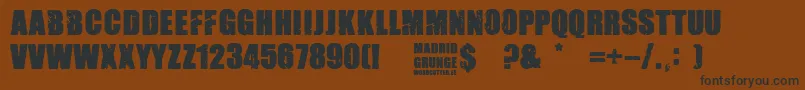 Madrid Grunge-Schriftart – Schwarze Schriften auf braunem Hintergrund