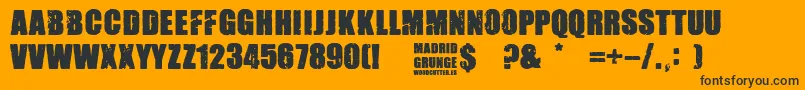 Madrid Grunge-Schriftart – Schwarze Schriften auf orangefarbenem Hintergrund