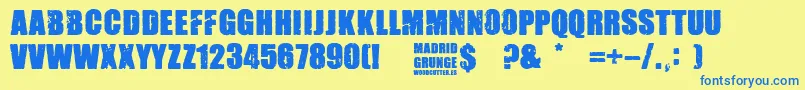 Madrid Grunge-Schriftart – Blaue Schriften auf gelbem Hintergrund