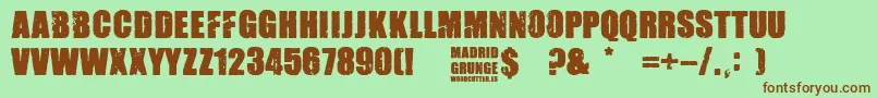 Madrid Grunge-Schriftart – Braune Schriften auf grünem Hintergrund