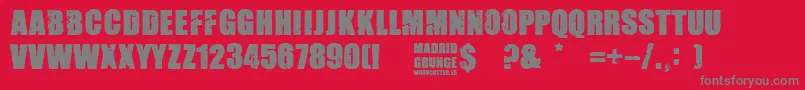 Madrid Grunge-fontti – harmaat kirjasimet punaisella taustalla