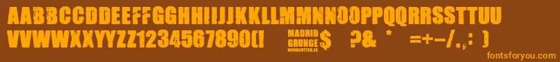 Madrid Grunge-Schriftart – Orangefarbene Schriften auf braunem Hintergrund