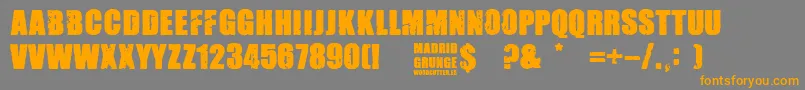 Madrid Grunge-Schriftart – Orangefarbene Schriften auf grauem Hintergrund