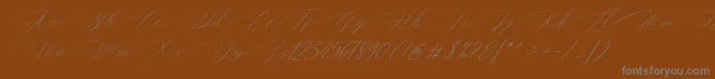 Magarella Script Font – Gray Fonts on Brown Background