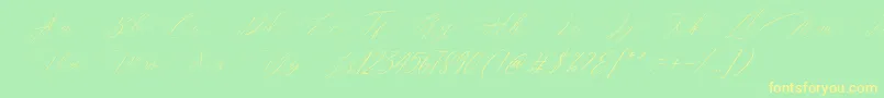フォントMagarella Script – 黄色の文字が緑の背景にあります