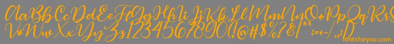 Magelove Font – Orange Fonts on Gray Background