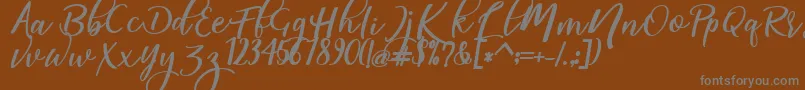 Czcionka magic dafont – szare czcionki na brązowym tle
