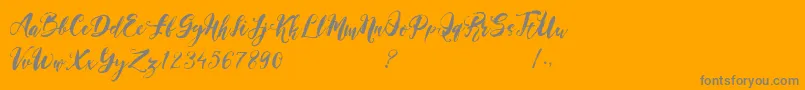 Magical Stylish Script Demo-Schriftart – Graue Schriften auf orangefarbenem Hintergrund