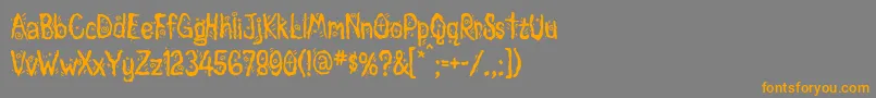 フォントMagician – オレンジの文字は灰色の背景にあります。