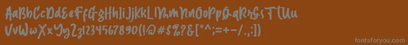 フォントMagnetto – 茶色の背景に灰色の文字