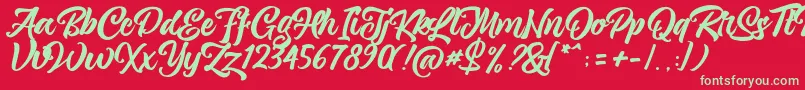 magnison Script Free Font – Green Fonts on Red Background