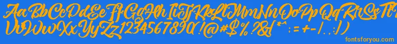 magnison Script Free-fontti – oranssit fontit sinisellä taustalla