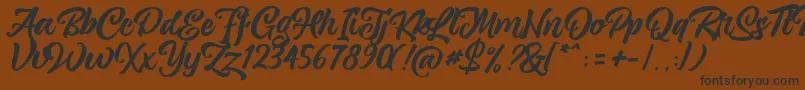 magnison Script Free-Schriftart – Schwarze Schriften auf braunem Hintergrund