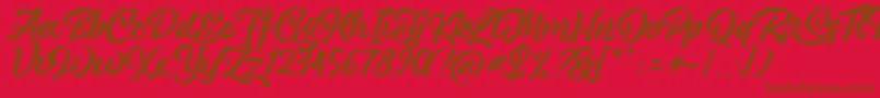 Шрифт magnison Script Free – коричневые шрифты на красном фоне