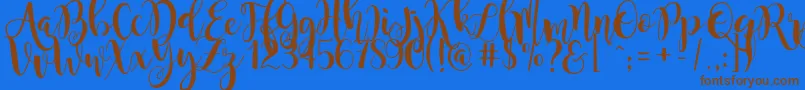 フォントmagnolia sky – 茶色の文字が青い背景にあります。