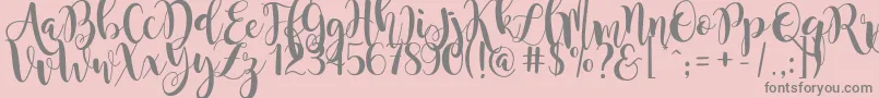 フォントmagnolia sky – ピンクの背景に灰色の文字