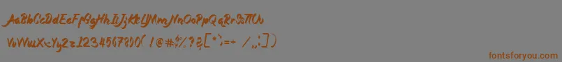 フォントMagnolia – 茶色の文字が灰色の背景にあります。