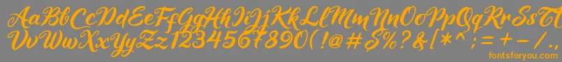 Maheera Font – Orange Fonts on Gray Background