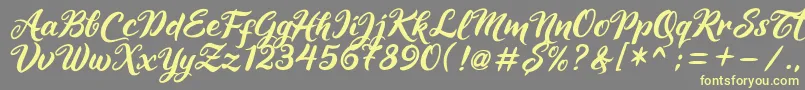 Maheera Font – Yellow Fonts on Gray Background
